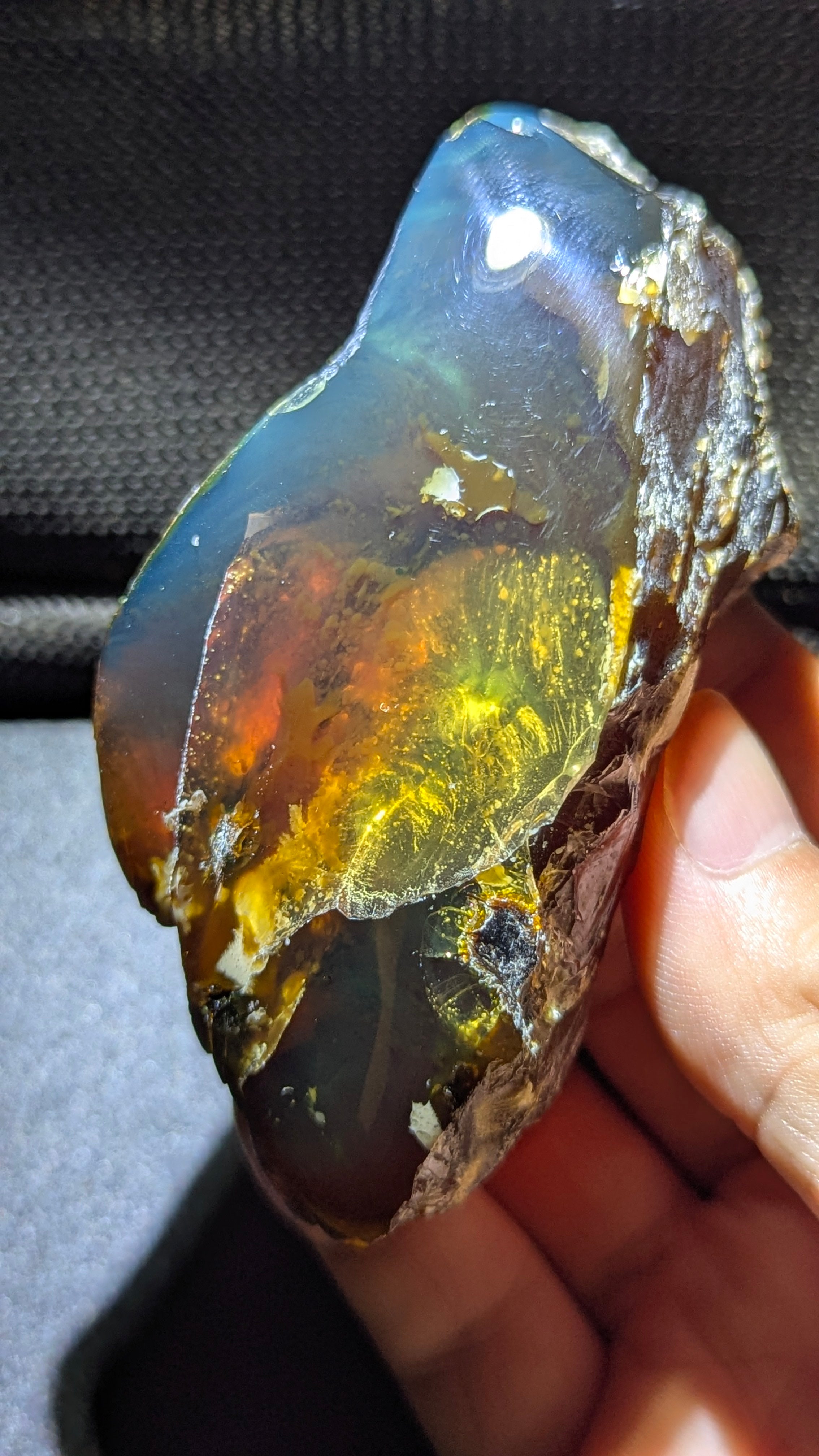 73G Natural Sumatran Blue Amber “Golden Storm Nebula” — Rare Polished Collector Specimen with Blue-Green Glow & Fiery Honey Inclusions