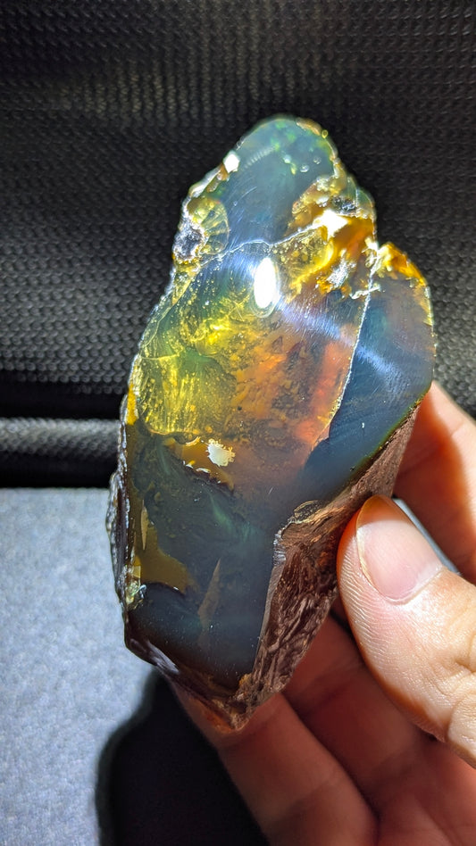 73G Natural Sumatran Blue Amber “Golden Storm Nebula” — Rare Polished Collector Specimen with Blue-Green Glow & Fiery Honey Inclusions