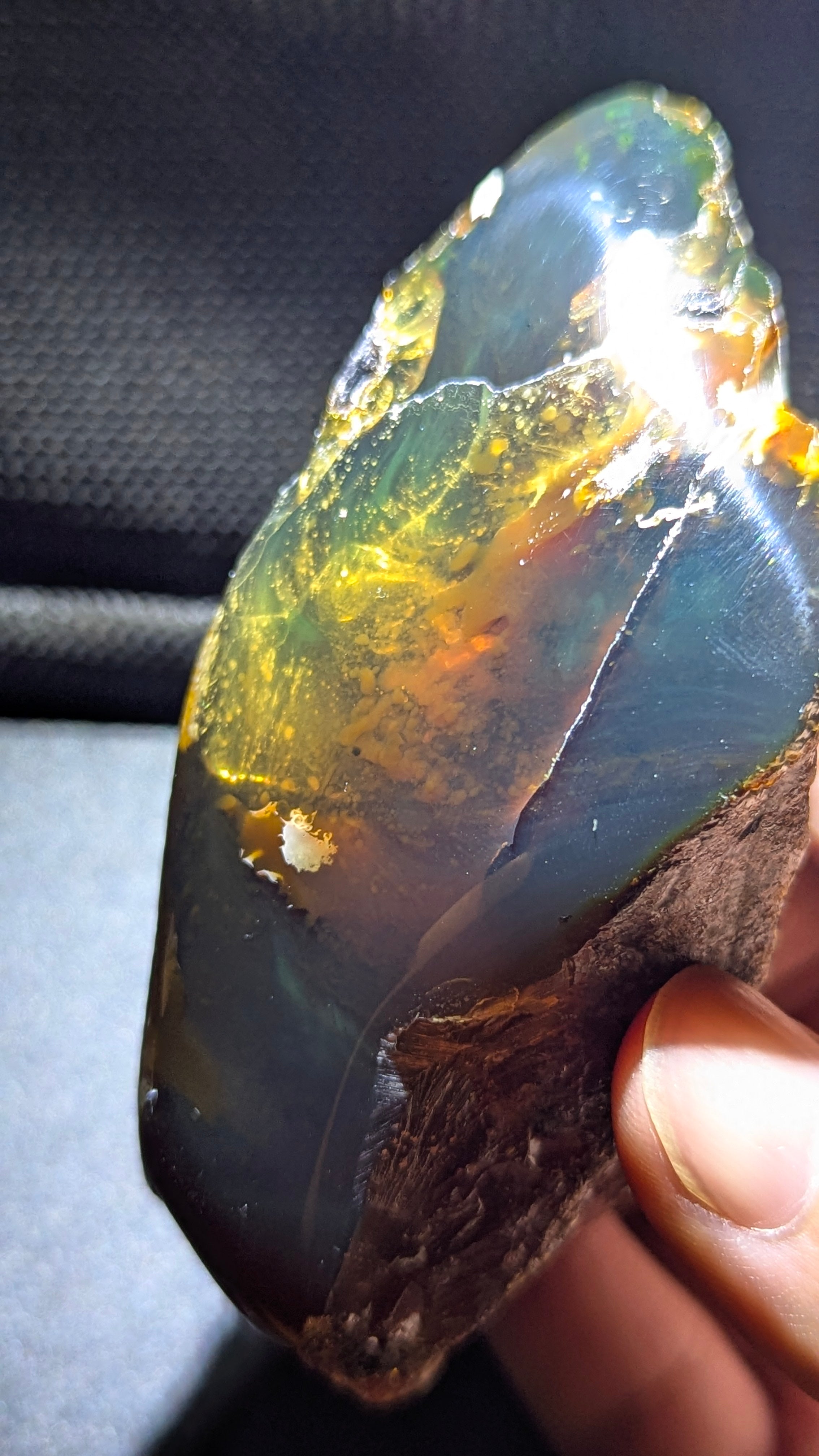 73G Natural Sumatran Blue Amber “Golden Storm Nebula” — Rare Polished Collector Specimen with Blue-Green Glow & Fiery Honey Inclusions