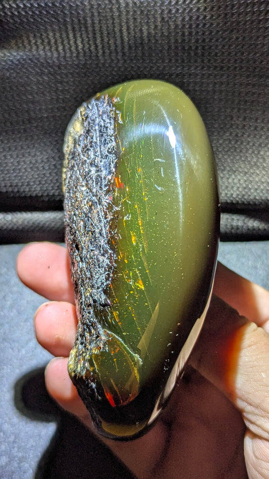 Natural Sumatran Blue Amber “Emerald Comet” 79g — Rare Polished Collector Specimen with Green Glow, Golden Fireflies & Raw Bark Edge