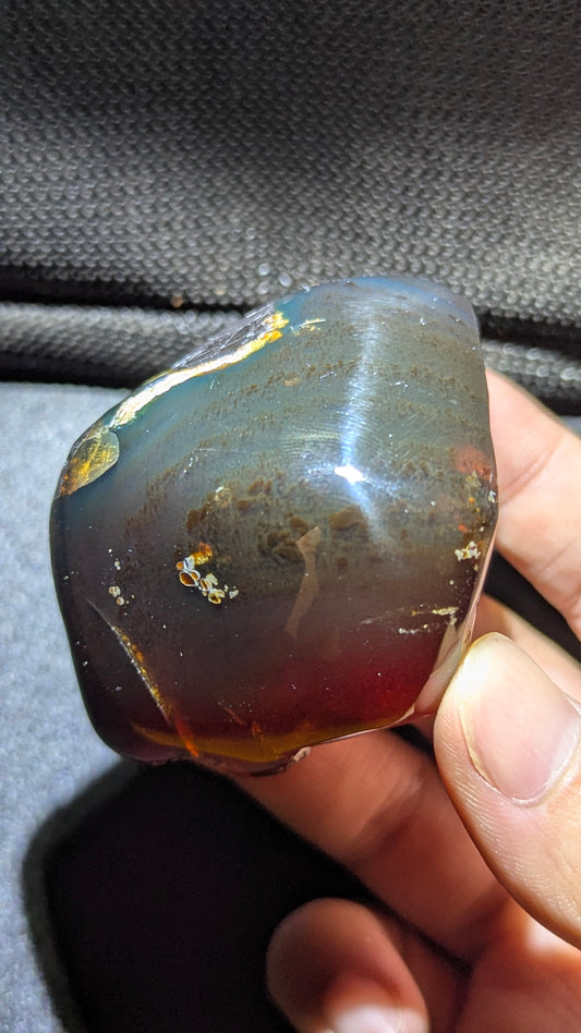 Natural Sumatran Blue Amber “Blue Moon Eclipse” 42G — Rare Polished Collector Specimen with Blue-Green Glow, Golden Star Inclusions & Raw Edge